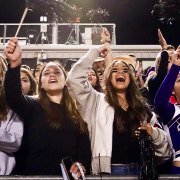 Lemoore's fans cheer on the halftime Homecoming show.